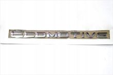 Anagrama "ECOMOTIVE" plateado